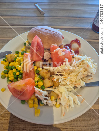 Homemade lunch plate with vegetables and bread roll Homemade lunch plate with vegetables and bread roll 140783117