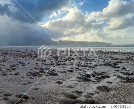 Rocky beach under dramatic cloudy sky Rocky beach under dramatic cloudy sky 140783192