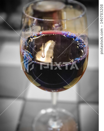 Glass of red wine in close up Glass of red wine in close up 140783208