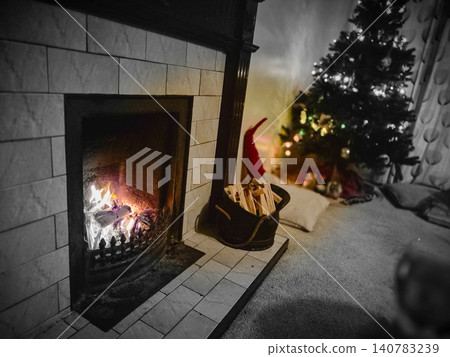 Cozy living room fireplace with Christmas tree Cozy living room fireplace with Christmas tree 140783239