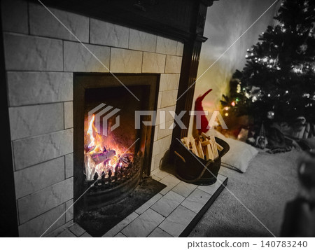 Cozy fireplace with Christmas tree in living room 140783240