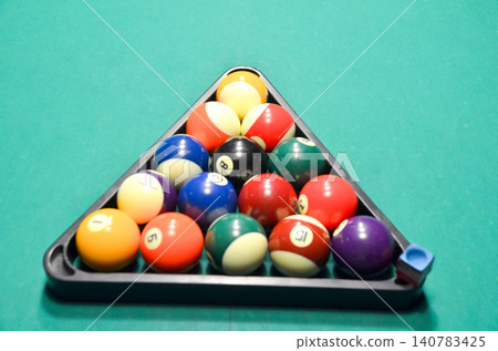 Rack of Billiard Balls on Green Pool Table Rack of Billiard Balls on Green Pool Table 140783425