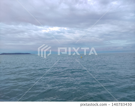 Calm ocean seascape under cloudy sky Calm ocean seascape under cloudy sky 140783430