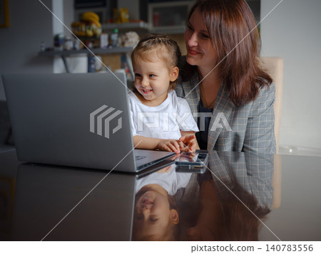 Remote Working Mother Balancing Home and Career 140783556