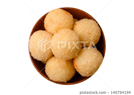 Cheese balls or potato croquettes, golden brown, fried with salt and spices. Cheese balls Cheese balls or potato croquettes, golden brown, fried with salt and spices. Cheese balls 140784194