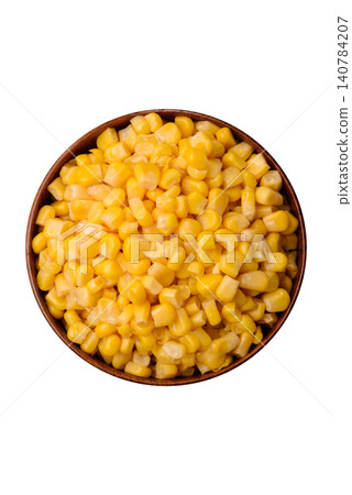 Golden, sweet canned corn kernels or maize for salads and vegetarian dishes. Canned corn 140784207