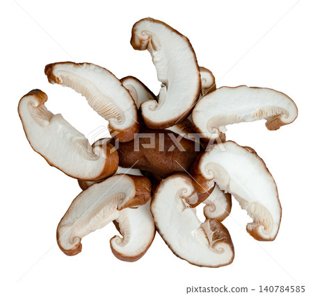 Top view of fresh sliced shiitake mushrooms arranged in a decorative circular pattern isolated. Edible brown fungi prepared for cooking, showcasing texture and cross-section. Top view of fresh sliced shiitake mushrooms arranged in a decorative circular pattern isolated. Edible brown fungi prepared for cooking, showcasing texture and cross-section. 140784585