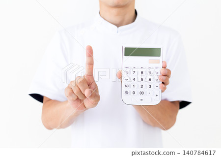 A middle-aged male acupuncturist/osteopath in a white coat, holding a calculator and raising his index finger. 140784617