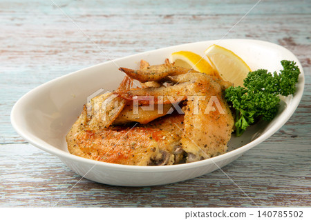 Herb-roasted chicken wings Herb-roasted chicken wings 140785502