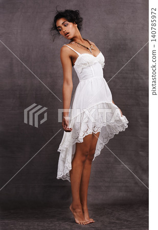Indian woman, dress and dance in studio for fashion with traditional accessory or jewelry and isolated on dark background. Female person, ballet and heritage with cultural style and confident Indian woman, dress and dance in studio for fashion with traditional accessory or jewelry and isolated on dark background. Female person, ballet and heritage with cultural style and confident 140785972