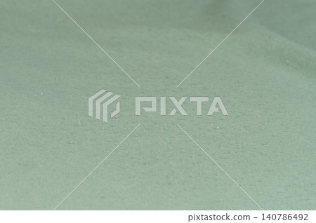 Cloth lint on green surface 140786492