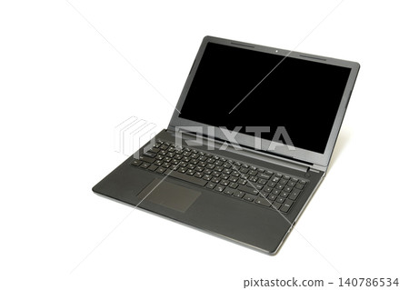 black laptop with an open lid is shown at a three quarter angle on a white background 140786534
