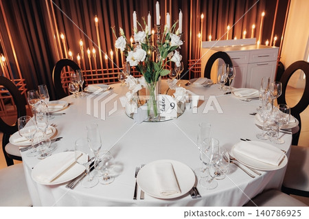 Elegant table set for a formal dinner Elegant table set for a formal dinner 140786925