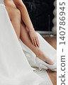 Elegant bride in white gown, poised, serene, graceful 140786945