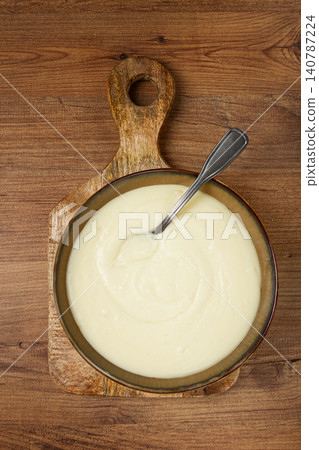 Mashed potatoes, with suluguni cheese, homemade, on a wooden table, no people, top view, Mashed potatoes, with suluguni cheese, homemade, on a wooden table, no people, top view, 140787224