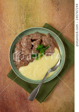 liver beef stroganoff with mashed potatoes, table setting in green tones, homemade, liver beef stroganoff with mashed potatoes, table setting in green tones, homemade, 140787244