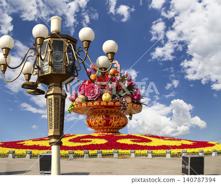 Street lamp and huge flower basket (against the background of a beautiful sky with clouds) in Tiananmen square, Beijing, China 140787394