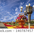 Street lamp and huge flower basket (against the background of a beautiful sky with clouds) in Tiananmen square, Beijing, China 140787457