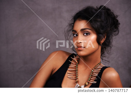 Indian woman, confident and fashion with jewelry in studio on grey background for heritage or culture. Portrait, female person and beauty with traditional necklaces, outfit and heritage look. 140787717