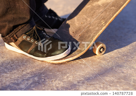 Closeup, skateboard and person with sneakers, skill and training with technique or fitness. Skater, practice or athlete with energy, sunshine or performance with weekend break, shoes or skating style Closeup, skateboard and person with sneakers, skill and training with technique or fitness. Skater, practice or athlete with energy, sunshine or performance with weekend break, shoes or skating style 140787728