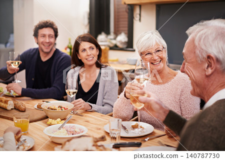Smile, cheers and family at dinner in dining room for party, celebration or event at modern home. Happy, bonding and group of people enjoying meal, supper or lunch together with wine at house. Smile, cheers and family at dinner in dining room for party, celebration or event at modern home. Happy, bonding and group of people enjoying meal, supper or lunch together with wine at house. 140787730
