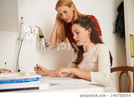 Teen, mom and help with studying in home, student and support for assignment or project. Mother, girl and schoolwork on weekend in bedroom, education and assistance or guidance for learning by desk Teen, mom and help with studying in home, student and support for assignment or project. Mother, girl and schoolwork on weekend in bedroom, education and assistance or guidance for learning by desk 140788059