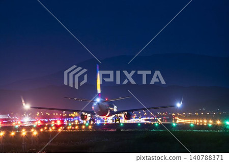 Sendai Airport at night, plane taking off, Natori City, Miyagi Prefecture Sendai Airport at night, plane taking off, Natori City, Miyagi Prefecture 140788371