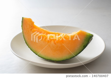 Red-fleshed melon against a white background 140788407