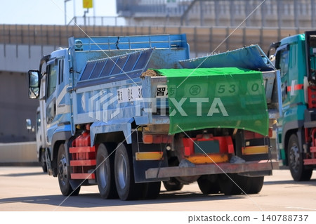 A dump truck in motion A dump truck in motion 140788737