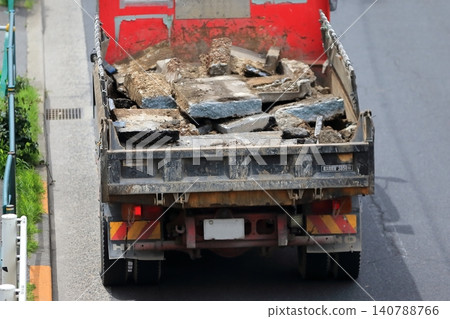 A dump truck in motion A dump truck in motion 140788766