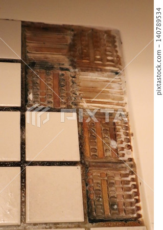 Bathroom floor with loose tiles 140789534