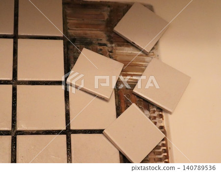 Bathroom floor with loose tiles 140789536