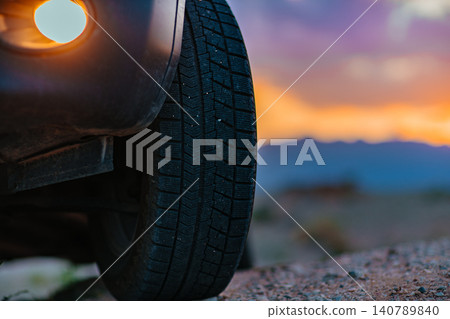 Car wheel offroad closeup view at twilight Car wheel offroad closeup view at twilight 140789840