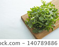 Fresh arugula on a cutting board 140789886
