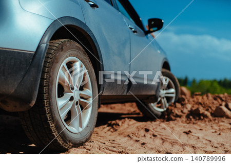 Car standing offroad on mud and sand Car standing offroad on mud and sand 140789996