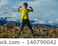 Happy strong boy on mountains background in summer 140790042