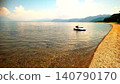 A luxurious summer relaxation time spent by a tranquil lakeside. 140790170