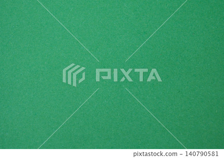 Full frame shot of green paper sheet. Colored paper or construction paper, is a type of paper that comes in a wide range of colors. Full frame shot of green paper sheet. Colored paper or construction paper, is a type of paper that comes in a wide range of colors. 140790581