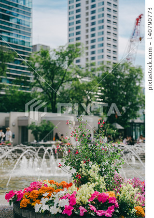 Flowers blooming in front of the building Flowers blooming in front of the building 140790773