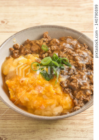 Donburi (rice bowl) with egg and minced meat in a thick sauce. Donburi (rice bowl) with egg and minced meat in a thick sauce. 140790899
