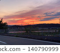 A road running through the sunset 140790999