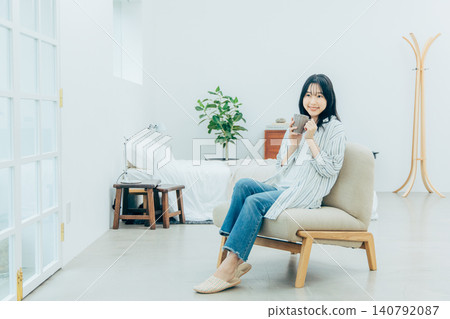 A young woman relaxing at home A young woman relaxing at home 140792087