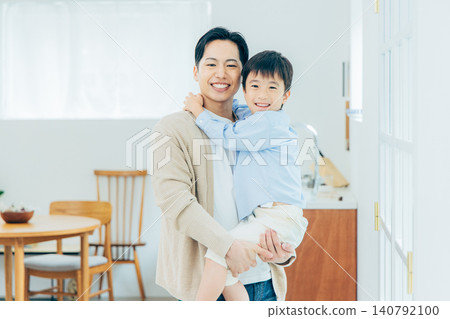 Young family, parents and children, living room Young family, parents and children, living room 140792100
