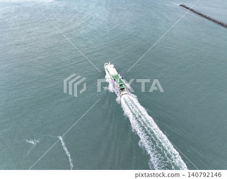<Bird's-eye view> A ferry boat bound for Rebun Island sailing across the sea. <Bird's-eye view> A ferry boat bound for Rebun Island sailing across the sea. 140792146