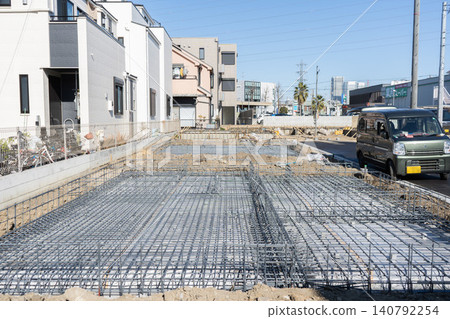 Reinforcement work for the foundations of houses in a residential development where multiple new detached houses will be built. Reinforcement work for the foundations of houses in a residential development where multiple new detached houses will be built. 140792254