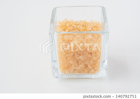 Coarse sugar in a glass container Coarse sugar in a glass container 140792751