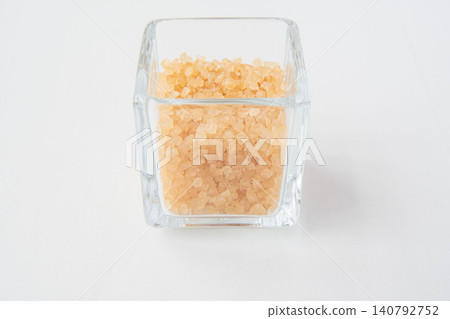Coarse sugar in a glass container Coarse sugar in a glass container 140792752