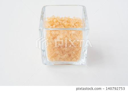 Coarse sugar in a glass container Coarse sugar in a glass container 140792753