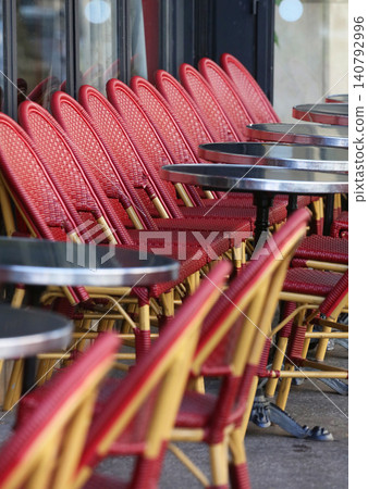 Chairs lined up in a cafe in Paris, France Chairs lined up in a cafe in Paris, France 140792996