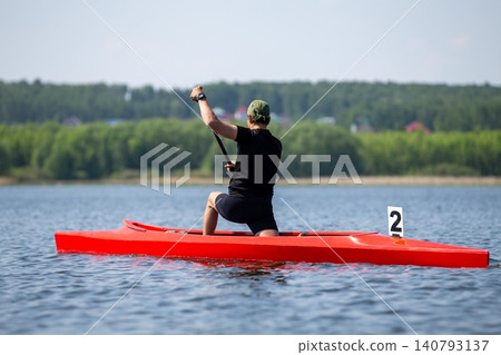 Athlete canoeist paddling Athlete canoeist paddling 140793137